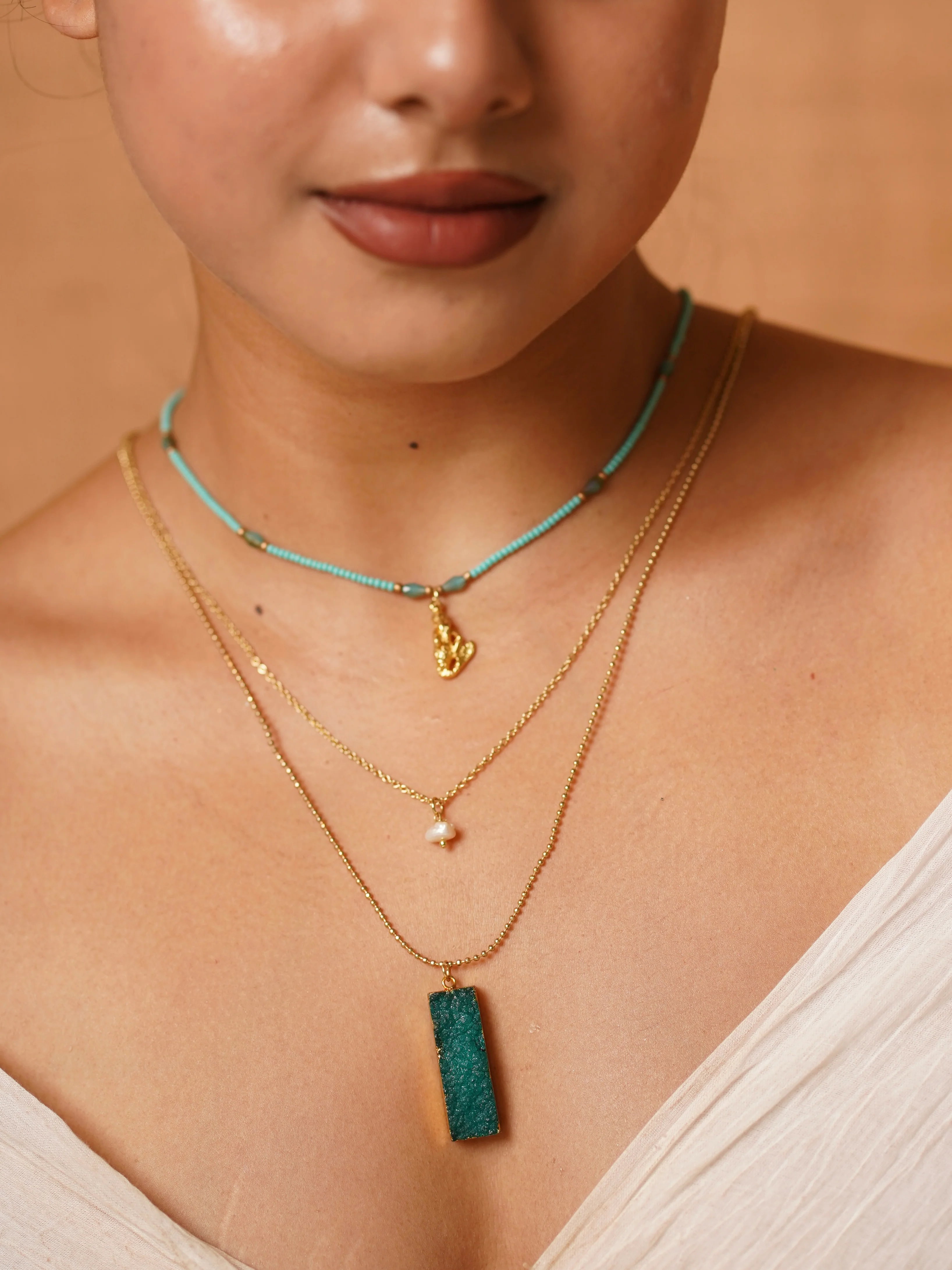 Symphony in layers—turquoise, pearl, and raw stone charm. - Image 2